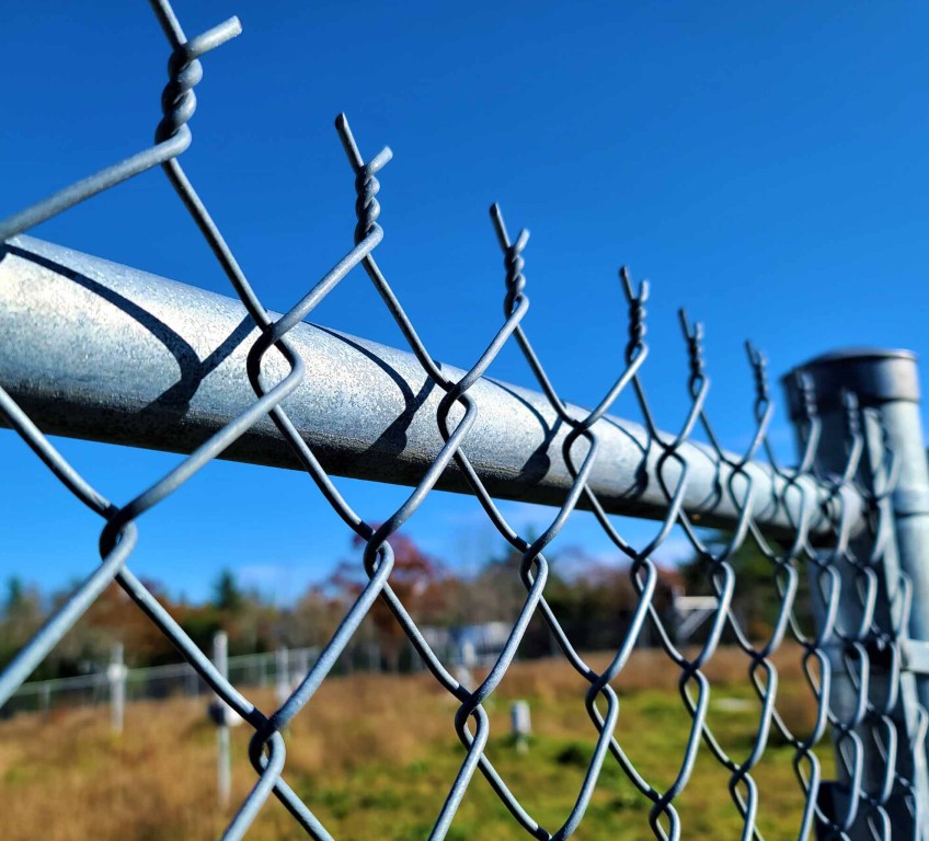 Detailed view of quality chain-link fencing installation in Madera, CA